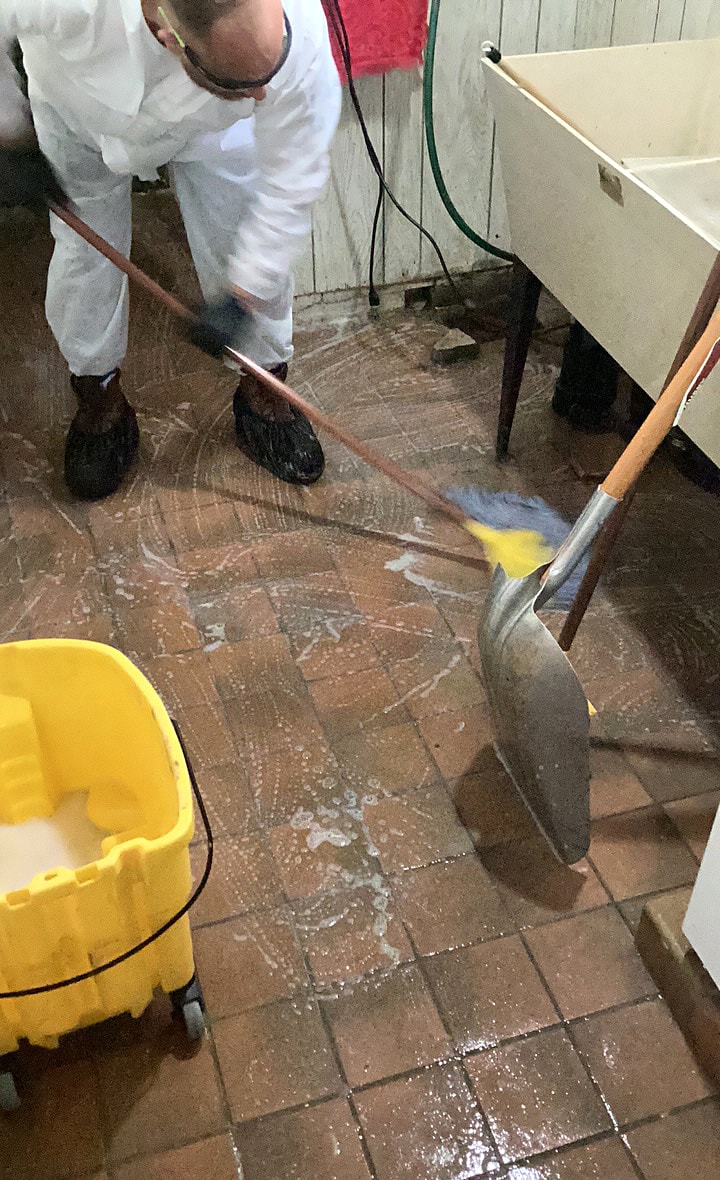 Cleveland West technician cleaning an affected floor
