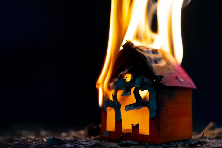 small paper house on fire