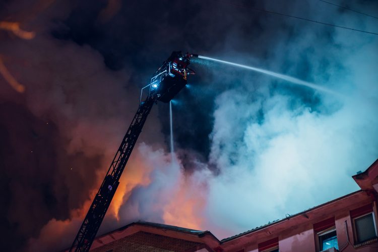 firefighters extinguishing a house fire