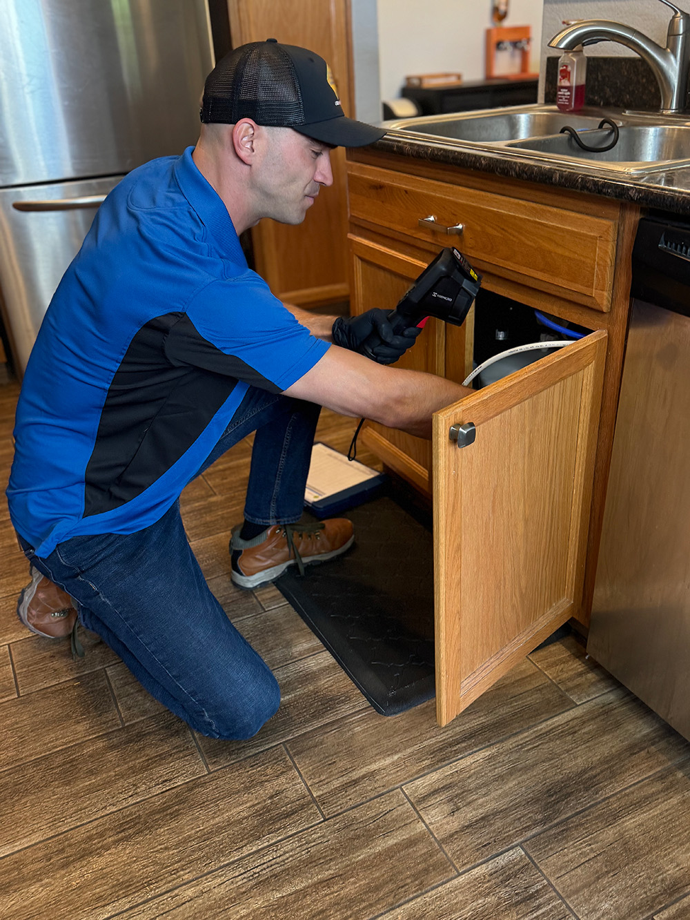 service tech under sink