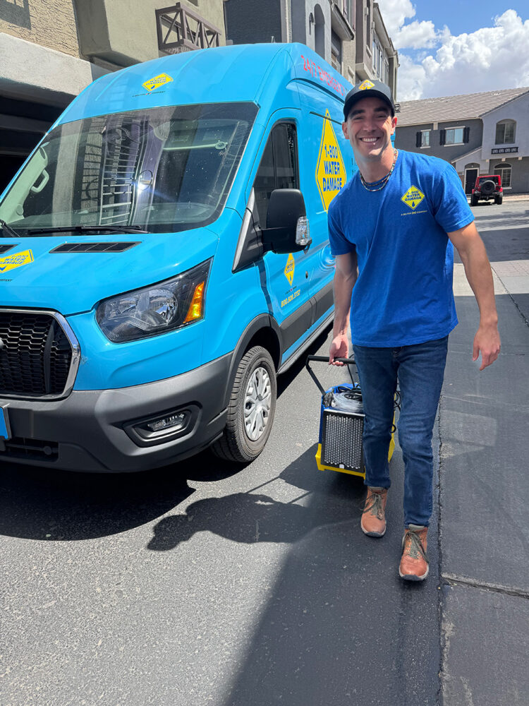 damage restoration tech with equipment