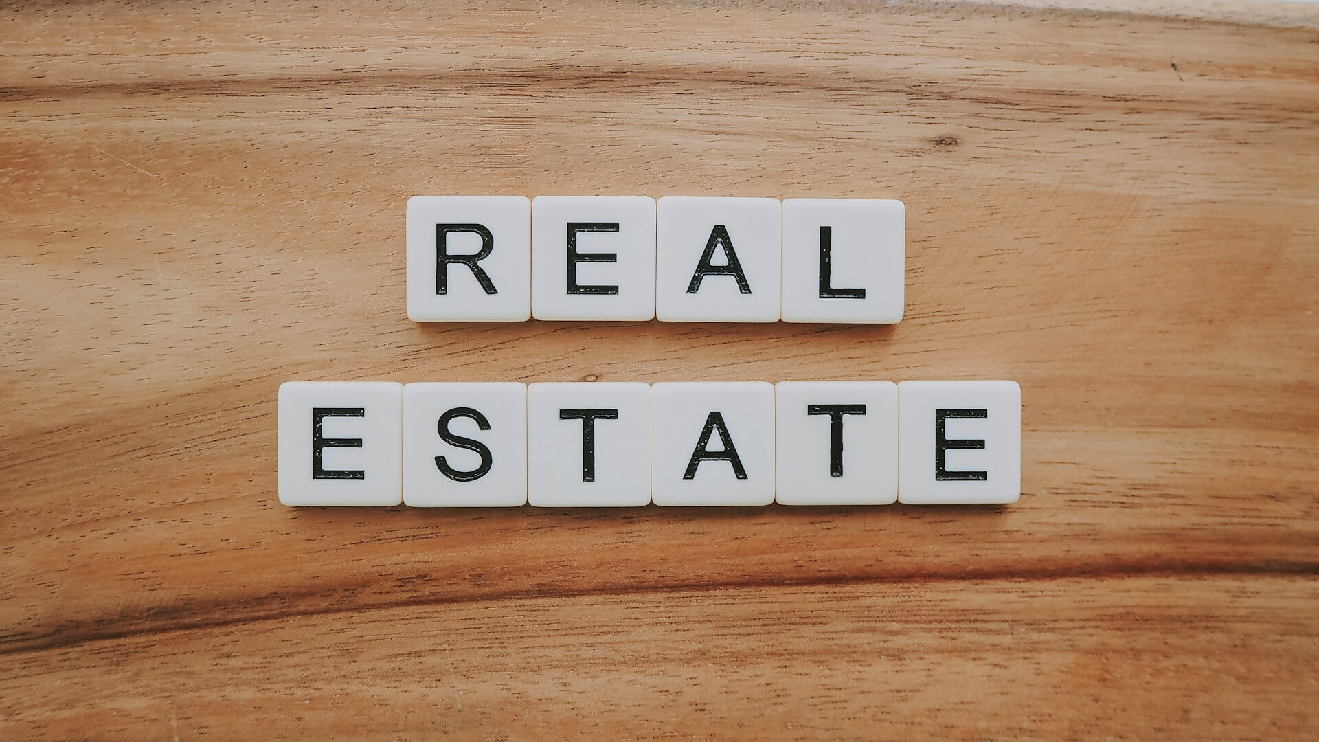 Real estate agent handing house keys to a client.