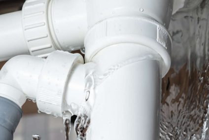 White pipe that's bursting with water